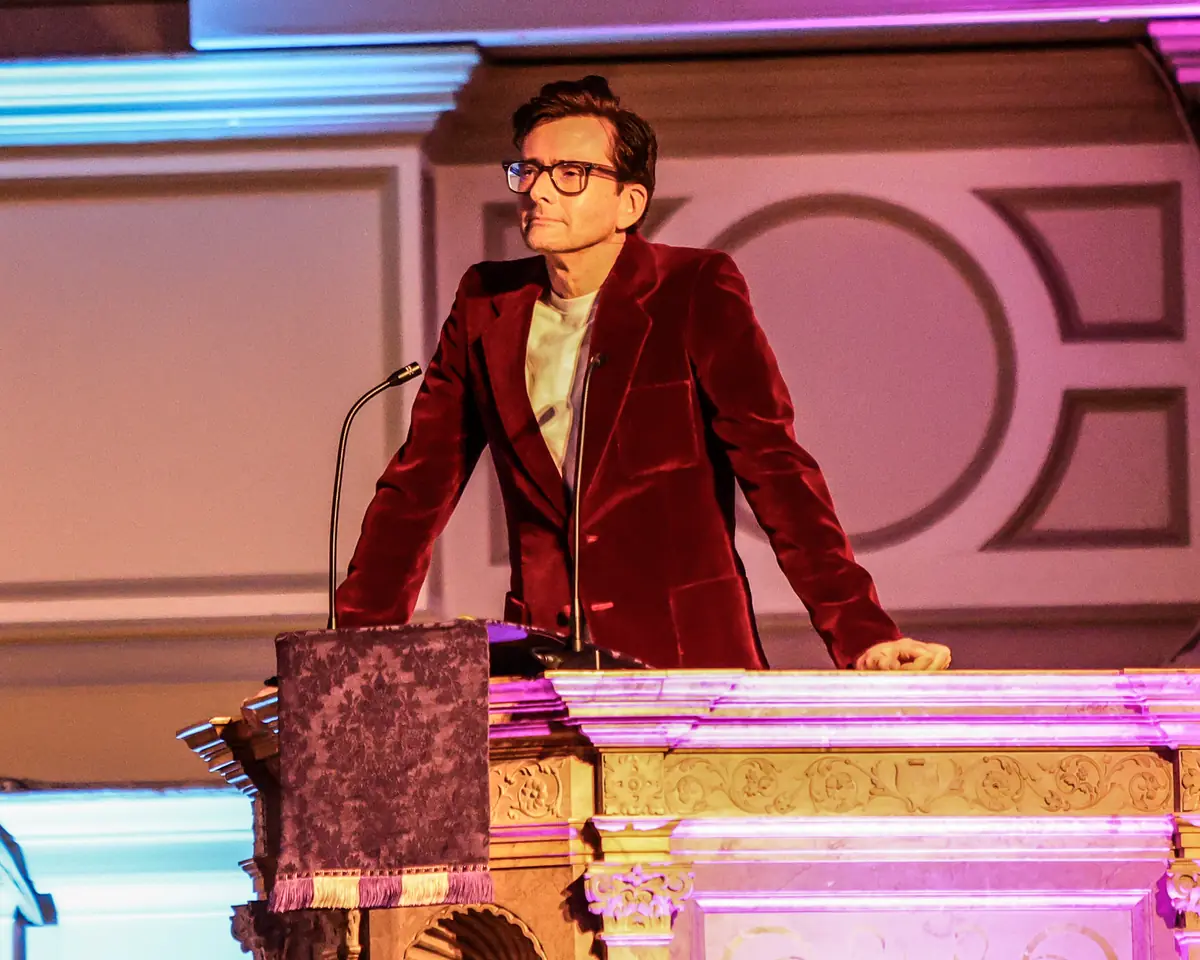 A celebrity reading at Christmas with the Stars 2025